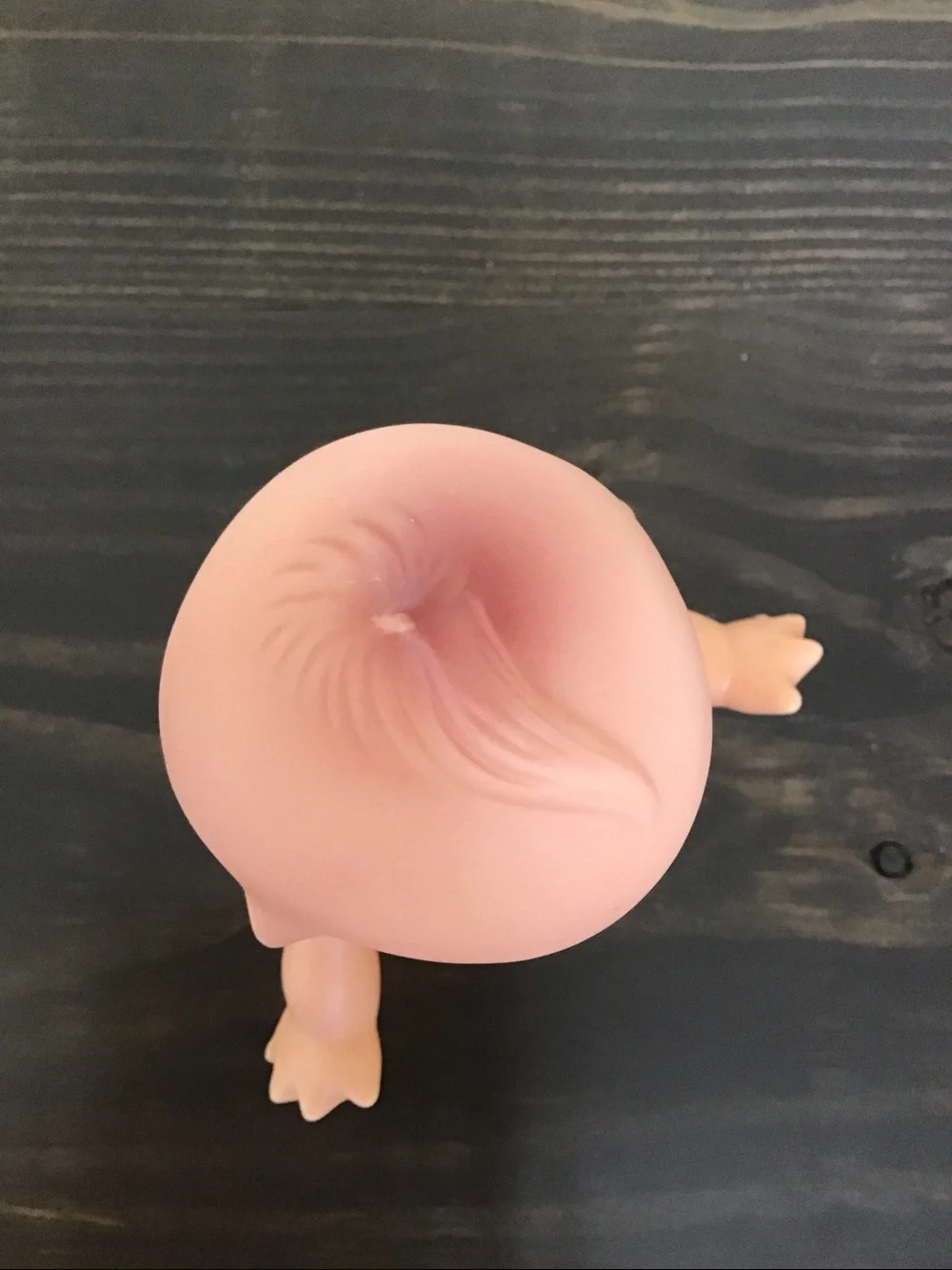 Vintage unmarked 6-inch hard plastic Kewpie doll from the mid-century era